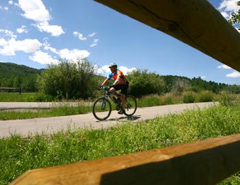 Ready for the (bike) ride of your life in Aspen? Road biker on a trail near Aspen